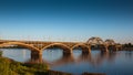 Volga bridge over Volga river at sunset time with reflection in water. Beautiful evening landscape