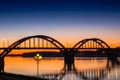 Volga bridge over Volga river after sunset with reflection in water, Yaroslavl region, Rybinsk city, Russia Royalty Free Stock Photo