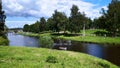 Volga river with beach and boats, woods in the background and pretty clouds in the sky Royalty Free Stock Photo