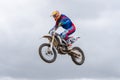 Volgograd, Russia - April 19, 2015: Motorcycle racer flying jumping on the trampoline, on the stage of the open championship motor