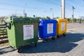 Volgograd, Russia - August 26, 2019: Three multi-colored garbage cans for various garbage collection, paper, plastic, etc