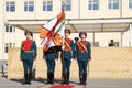 System of soldiers fly a flag, a banner of military unit Royalty Free Stock Photo