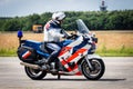 VOLKEL, THE NETHERLANDS - JUN 15, 2013: Dutch military police Marechaussee officer patrolling on motorcycle at the Dutch Air Royalty Free Stock Photo