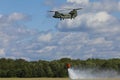 Volkel Netherlands June 13 2019: Royal Netherlands Air Force Chinook demonstrating firefighting with a Bambi bucket Royalty Free Stock Photo