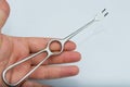 Volkman Retractor with two prongs in the human hand Royalty Free Stock Photo