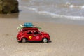 Volkswagen beetle made from metal on the beach. Royalty Free Stock Photo