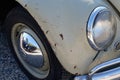 Volkswagen Beetle vintage old collector car with detail of a broken and rusty worn