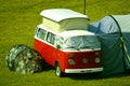 Volkswagen camper van camping in a field