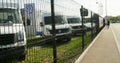 Volkswagen Commercial Vehicles trucks behind fence