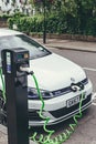 Volkswagen Golf GTE charging at a charging point on a street in London Royalty Free Stock Photo