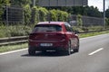 Volkswagen Golf Mark VIII red car driving on a highway Royalty Free Stock Photo