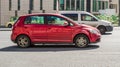 Volkswagen Golf Plus in red color on city road. VW Golf Plus is a compact van produced by Volkswagen Royalty Free Stock Photo