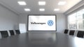 Volkswagen logo on the screen in a meeting room. Editorial 3D rendering