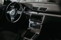 Volkswagen Passat B7, logo on the steering wheel, modern car automobile interior.