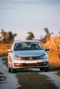 Volkswagen Polo Car Sedan Parking Near Country Road In Autumn Field Royalty Free Stock Photo