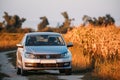 Volkswagen Polo Car Sedan Parking Near Country Road In Autumn Field In Sunny Evening. Royalty Free Stock Photo