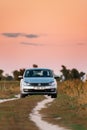 Volkswagen Polo Car Sedan Parking Near Country Road In Autumn Field. Sunset Sunrise Sky On A Background In Sunny Evening Royalty Free Stock Photo