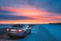 Volkswagen Polo Car Sedan Parking On A Roadside Of Country Road On A Background Of Dramatic Sunset Sky At Winter Season Royalty Free Stock Photo