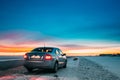 Volkswagen Polo Car Sedan Parking On A Roadside Of Country Road On A Background Of Dramatic Sunset Sky At Winter Season Royalty Free Stock Photo