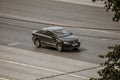 Volkswagen Polo Mk6 Sixth generation car moving on the highway on high speed. Auto driving along the street in city, aerial front