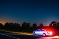 Volkswagen Polo at night on the roadside under the starry sky. D