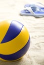 Volleyball ball and flip-flops