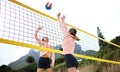 Volleyball, beach and spike with sports women playing a game outdoor for training or competition. Team, sport and ball Royalty Free Stock Photo