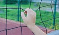 Volleyball boy`s hand holding a volleyball net Royalty Free Stock Photo