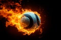 A volleyball engulfed in flames stands out against a black background