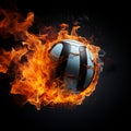 A volleyball engulfed in flames stands out against a black background