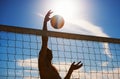 Volleyball, fitness and man at beach with ball serve, energy or freedom on blue sky background. Seaside, sports or male Royalty Free Stock Photo