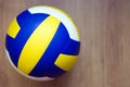 Volleyball on hardwood floor Royalty Free Stock Photo