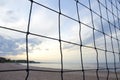 Volleyball net on the background of blurred sandy beach