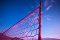 Volleyball net stands tall in vibrant purple, ready for action