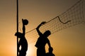 Volleyball playing people silhouettes Royalty Free Stock Photo