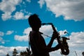 Volodymyr Lebedyev plays saxophone, Arsen Mirzoyan rock band, live concert in Pobuzke, Ukraine, 15.07.2017, editorial photo