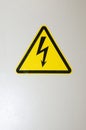 Voltage control sign. High voltage. Caution and warning yellow sign