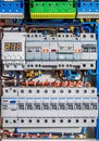 Voltage distributor with automatic switches. Electrical background.