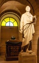 Voltaire`s tomb and statue in the crypt of the Pantheon in Paris Royalty Free Stock Photo