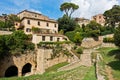 Volterra cityscape inside city walls, vintage houses on a hill surounded by pine and cypress trees, Tuscany Royalty Free Stock Photo