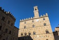 Volterra town central square, medieval palace Palazzo Dei Priori landmark Royalty Free Stock Photo