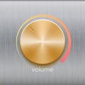 Volume button with golden brushed texture and color scale isolated on metal texture background Royalty Free Stock Photo