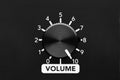 Volume control knob of a black amplifier on maxiumum loudness Royalty Free Stock Photo