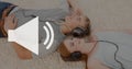 Volume icon against people listening to music photo