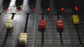 The volume of professional audio mixer in a radio broadcast