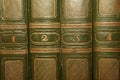 Volumes of old books with gold lettering on the cover Royalty Free Stock Photo