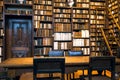 Volumes of 17th century books and 18th on bookshelves of an old library, antique book collection