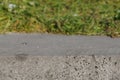 Volumetric background of green grass and concrete. Royalty Free Stock Photo