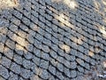 Volumetric geogrid at the base of a pedestrian road, road construction, reinforcement covered with fine gravel. Modern