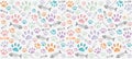 Volumetric prints of cat`s paws and skeletons of fish of different colors on a light gray background Royalty Free Stock Photo
